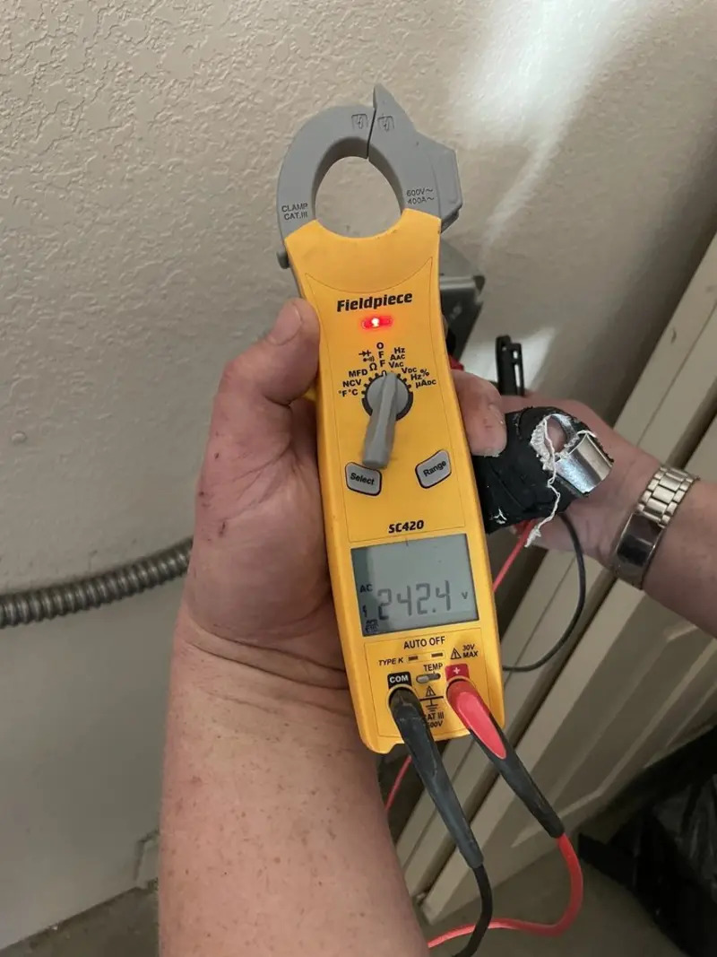 Voltage testing with clamp meter during Outlet Installation in Monticello